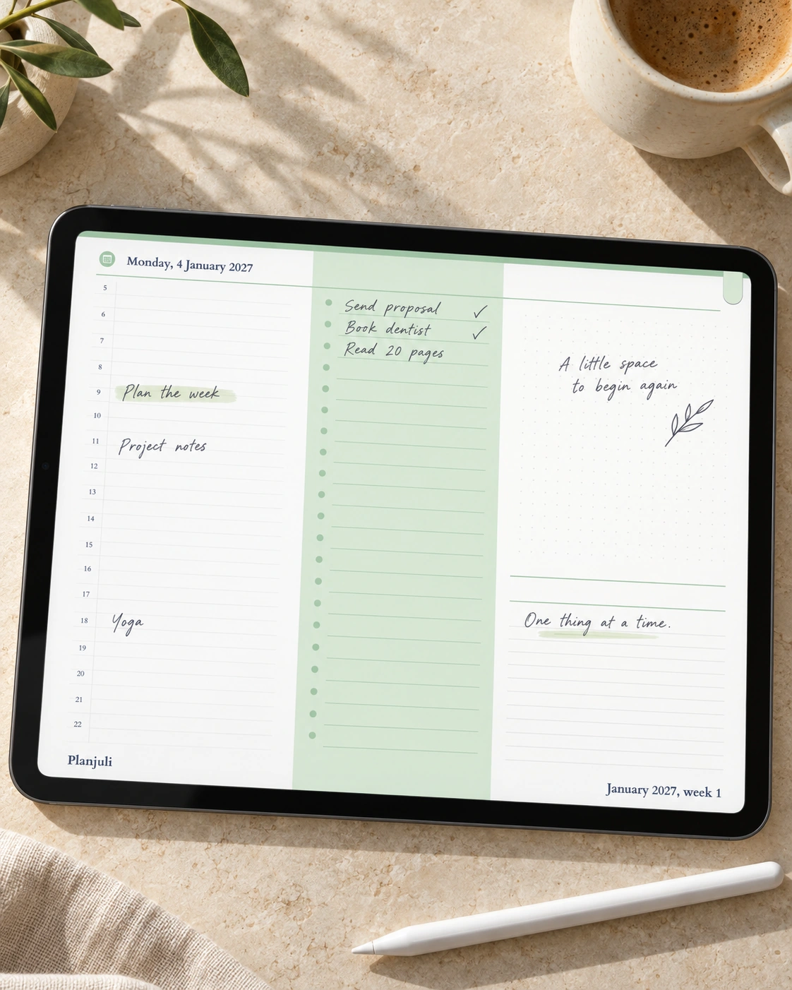 Daily schedule with handwritten tasks and notes in the Planjuli 2027 Pastel Green planner, shown on a landscape iPad on polished stone