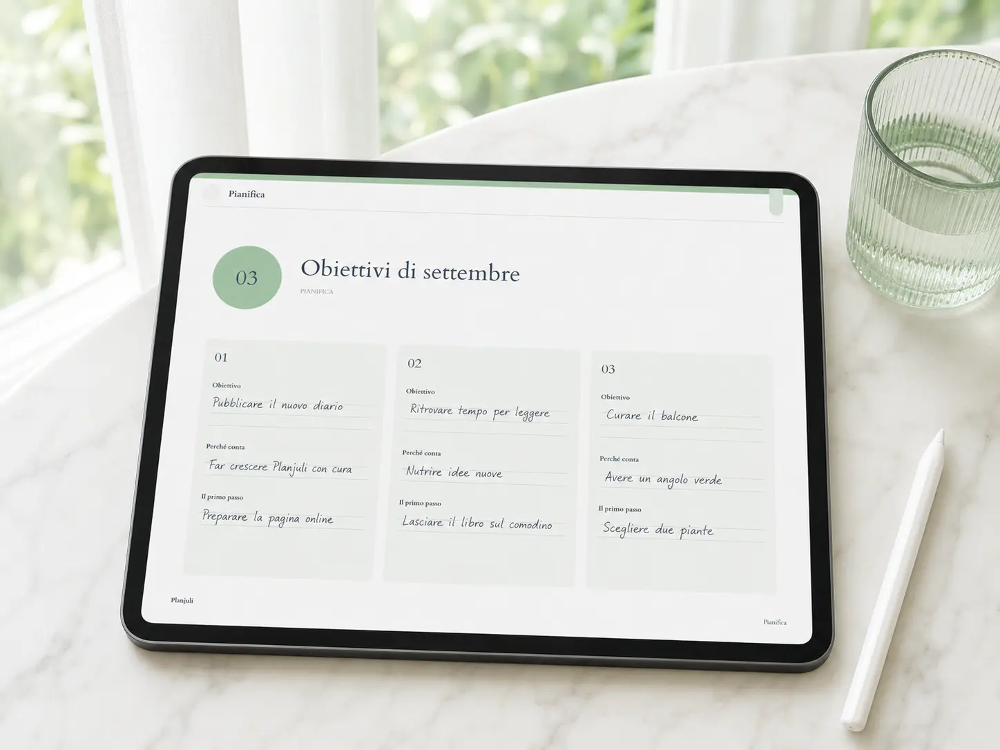 Diario digitale Reset di Settembre Verde Pastello aperto su iPad, con la pagina degli obiettivi compilata a mano.